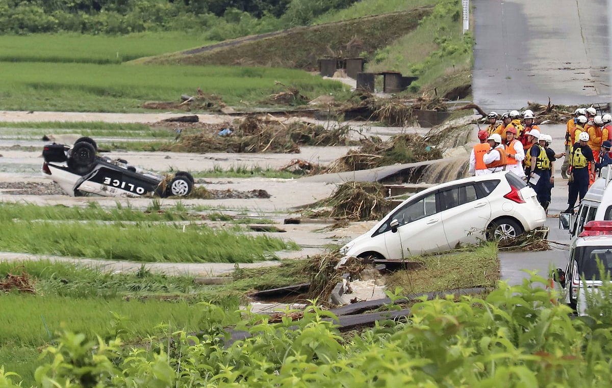 A police vehicle is seen overturned following a heavy rain in Shinjo, Yamagata prefecture, northern Japan Friday, July 26, 2024. 

 - AP
